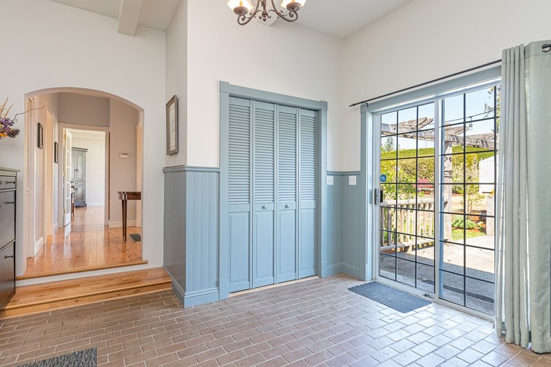 Bright interior entry with blue built-in cabinetry at the Emandare farmhouse