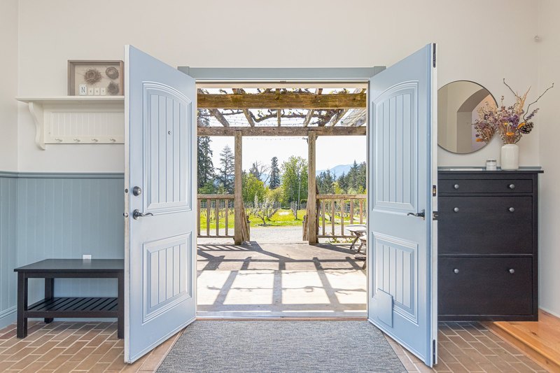 Open double doors looking toward the vineyard at Emandare Winery and Vineyard